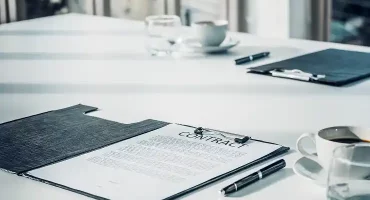 close-up-business-contract-paper-on-meeting-room-t-2026-01-06-08-54-51-utc 1
