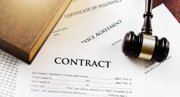 contract-agreement-and-gavel-on-wooden-table-2026-01-05-22-56-11-utc 1