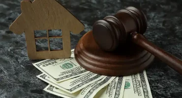 gavel-money-and-house-model-on-textured-backgroun-2026-03-24-22-42-06-utc 1